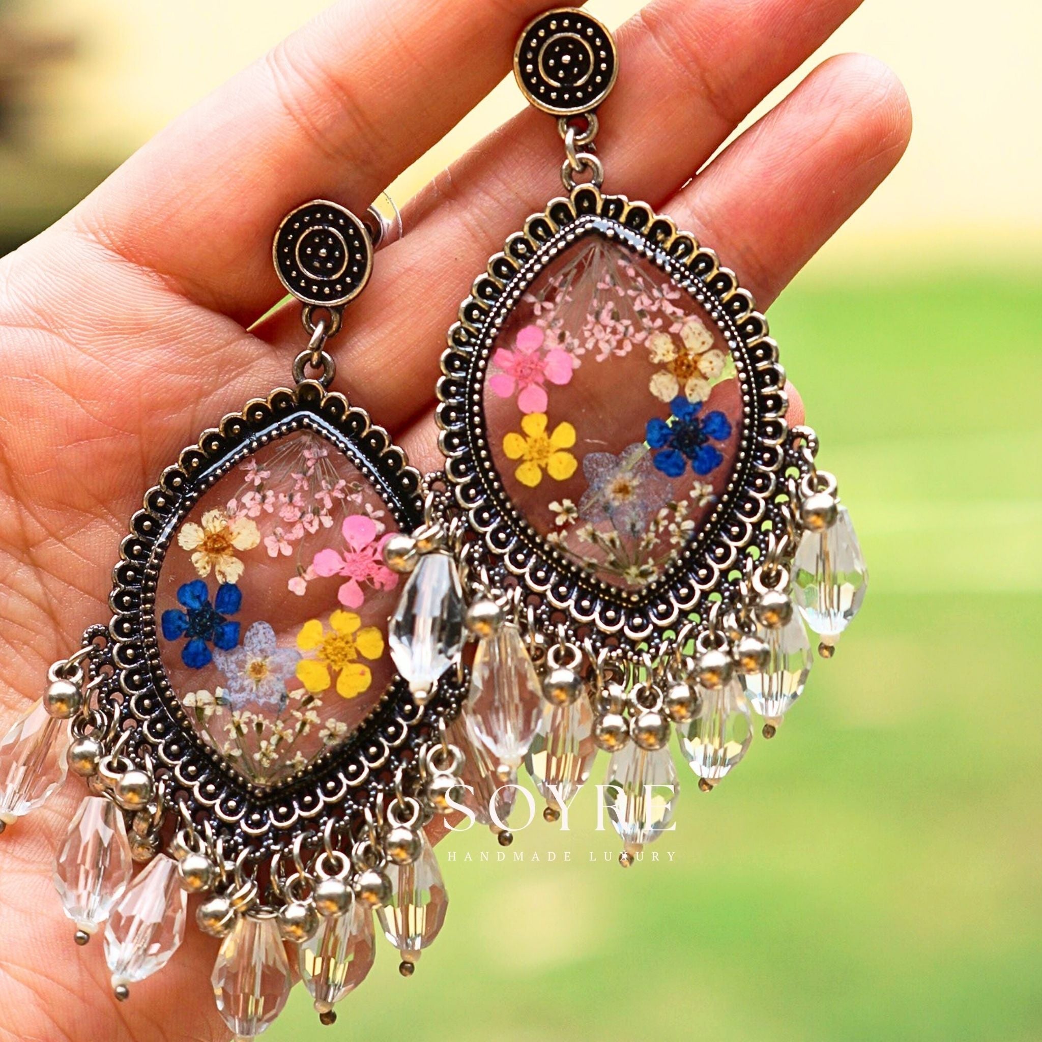 Handmade jewelry earrings made of real flowers