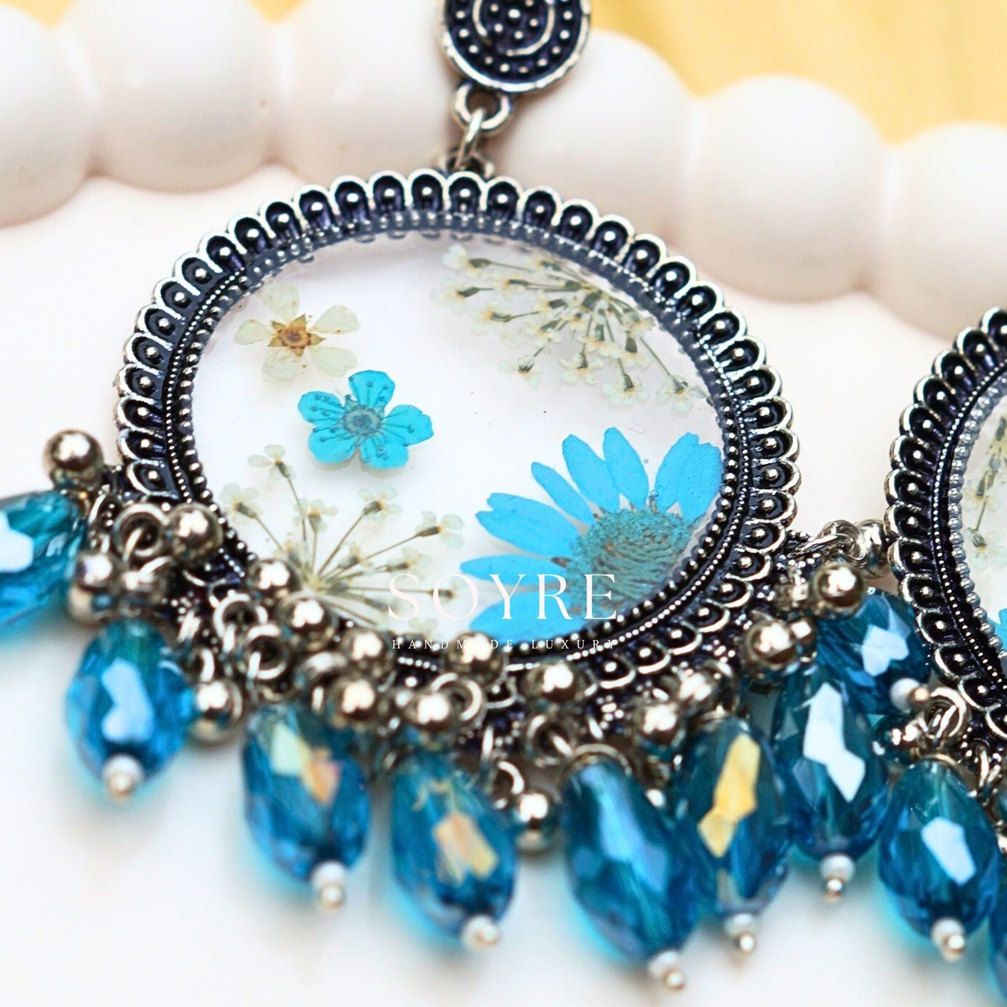 Handmade jewelry earrings made of real flowers